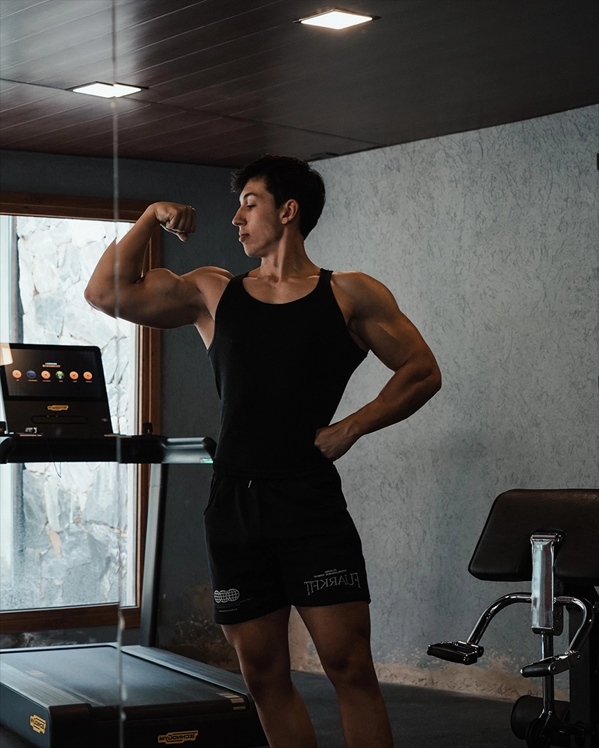 teo doing a gym pose without shirt